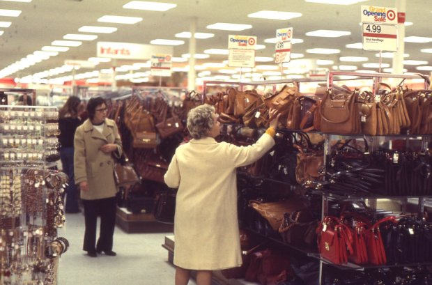 a person looking at the phone in a store