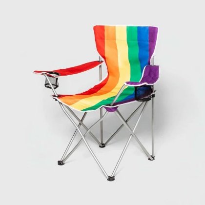 a chair with a colorful blanket