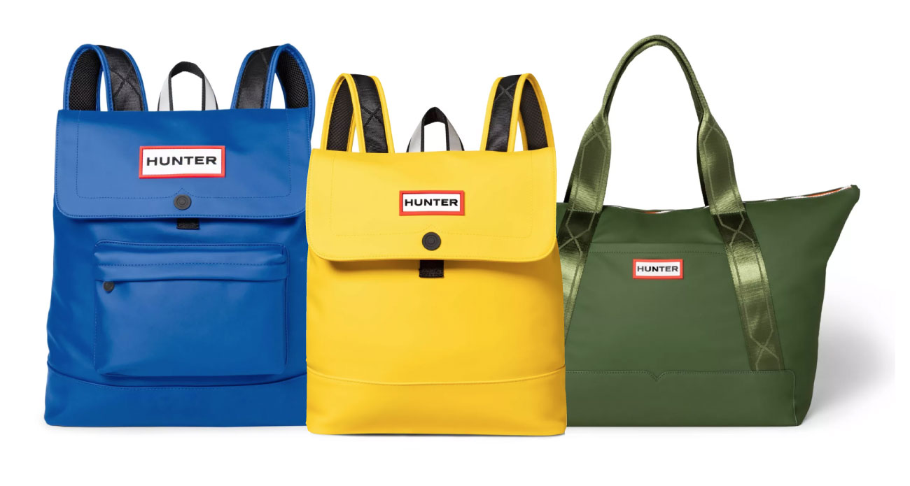 Three Hunter backpacks and bags in blue, green and yellow