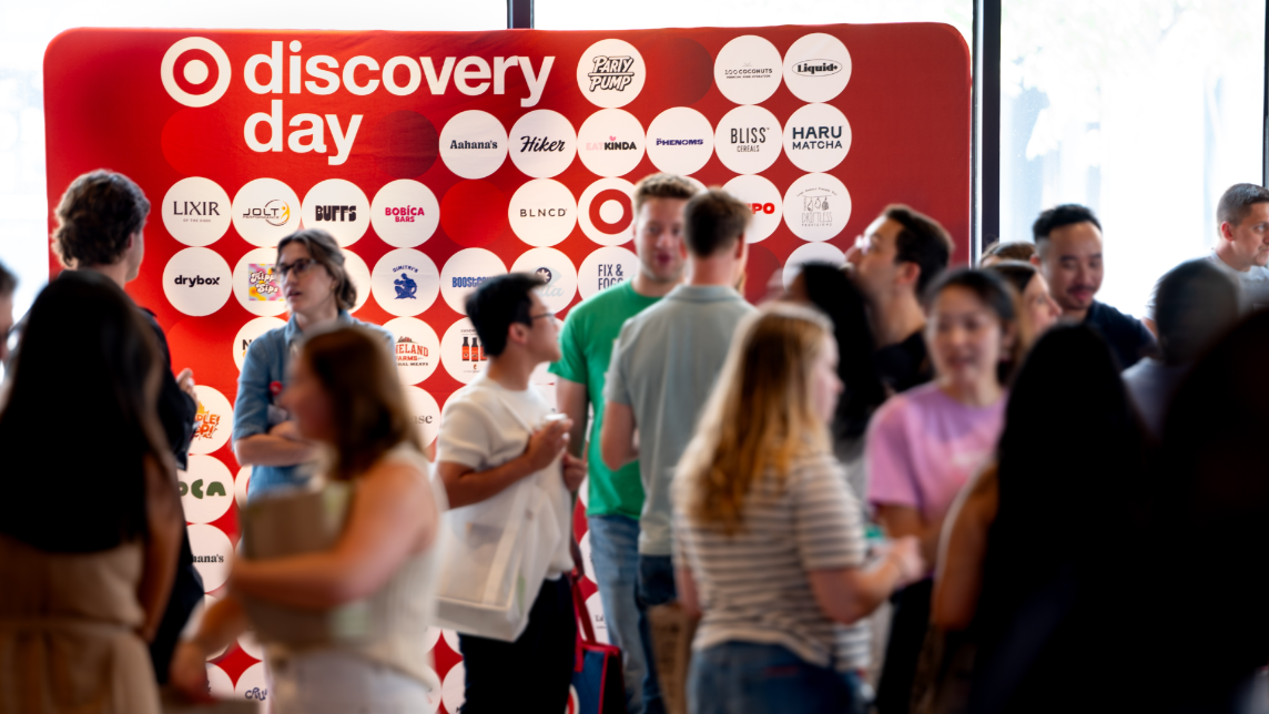 A group of people mingles at a Target-hosted event