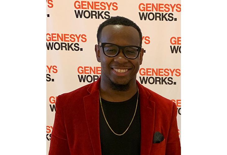 A head-and-shoulders shot of Davon standing in front of a Genesys Works background wall