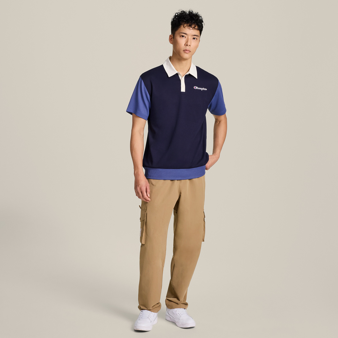 A model wearing Champion for Target shirt and cargo pants.