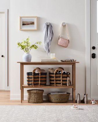 a shelf with baskets and objects on it