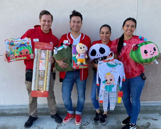 a group of people holding boxes