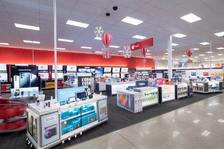 Target's electronics section, alight with screens and colorful signage.