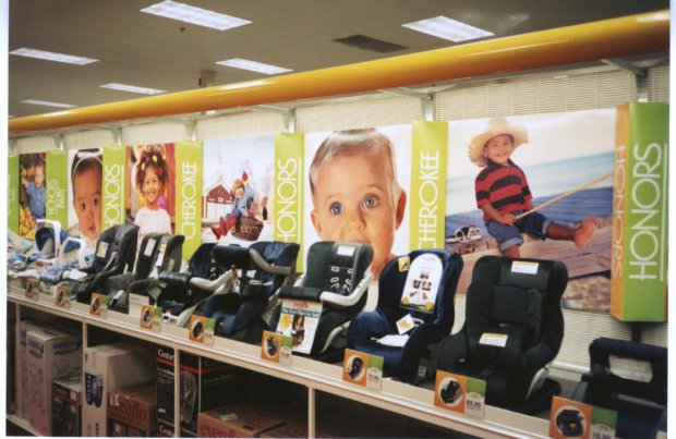 a shelf with a book and a picture of a boy on it