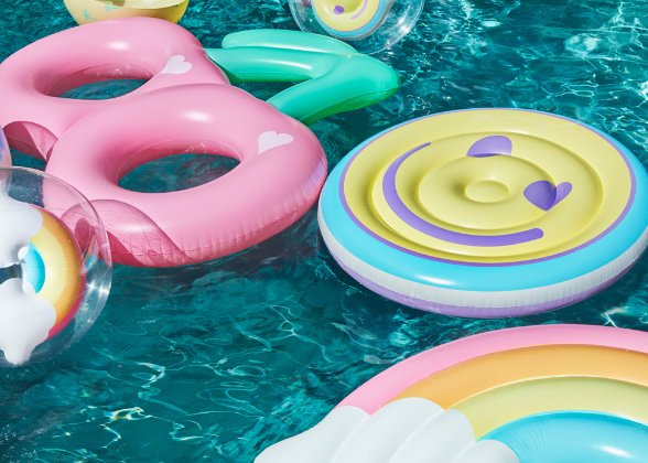 a group of colorful plastic toys in a pool