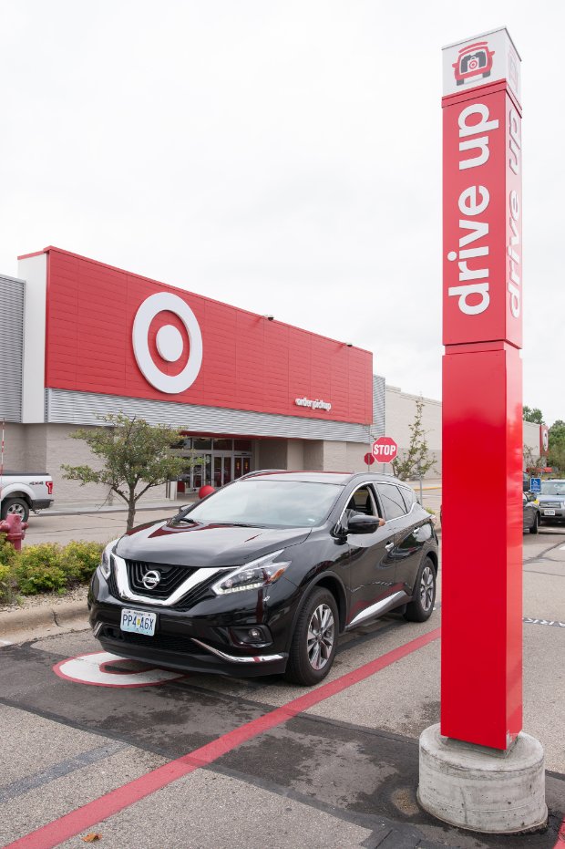a car parked in front of a gas station