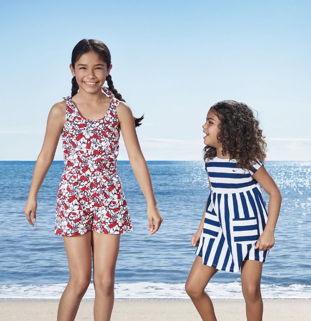 two women in swimsuits on a beach