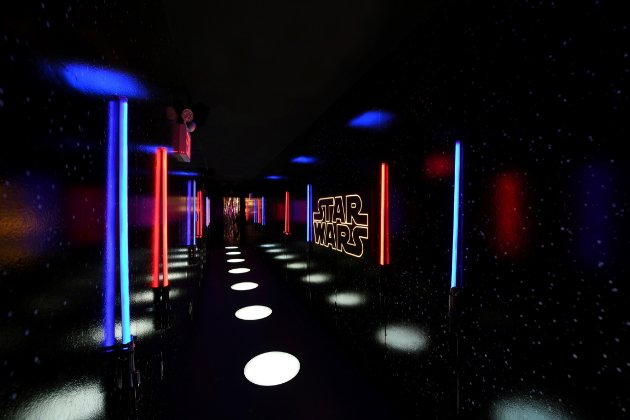 a dark hallway with bright lights