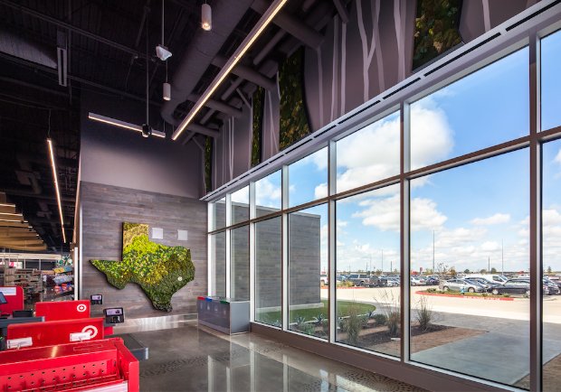 a room with a large window and a tree in it