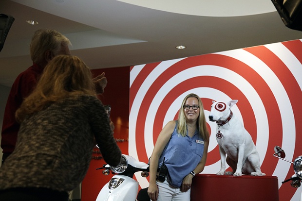 a person on a motorcycle with a dog on the back