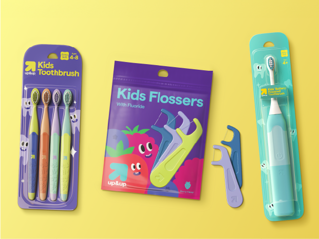 Packages of up&up kids’ toothbrushes, kids’ flossers and an electric toothbrush.