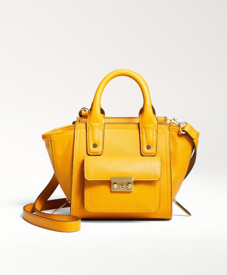 a yellow handbag with a strap