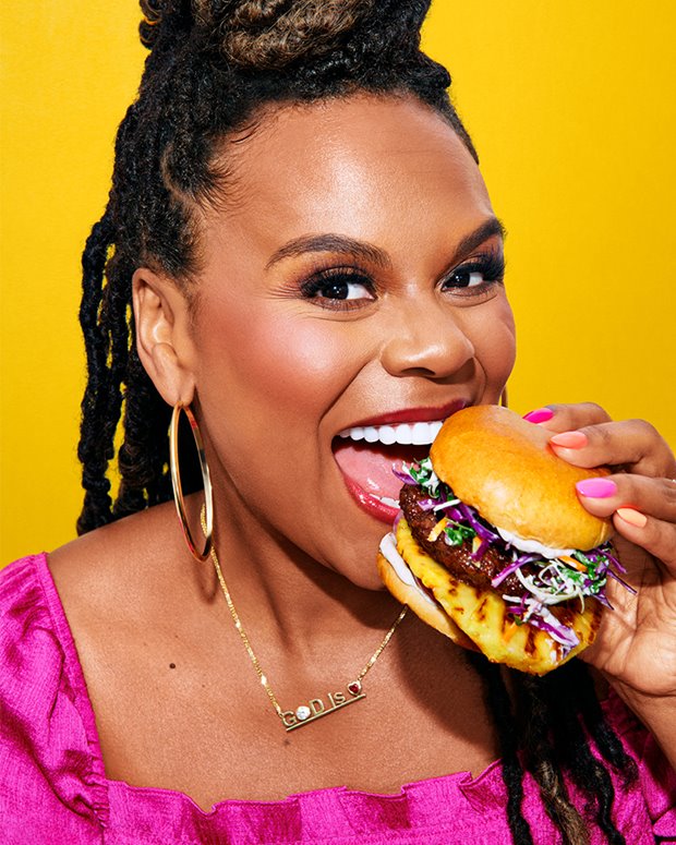 a woman eating a donut