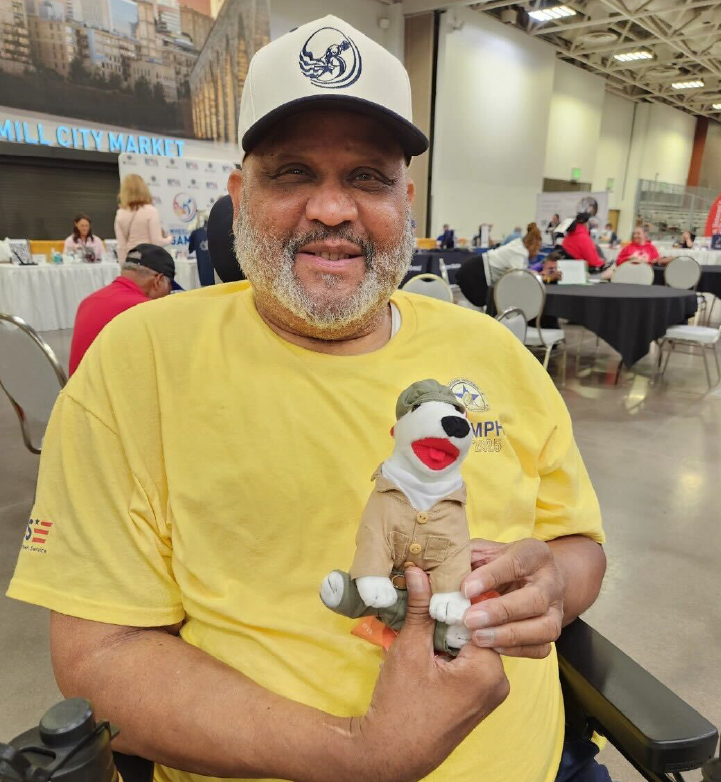 a man holding a stuffed animal