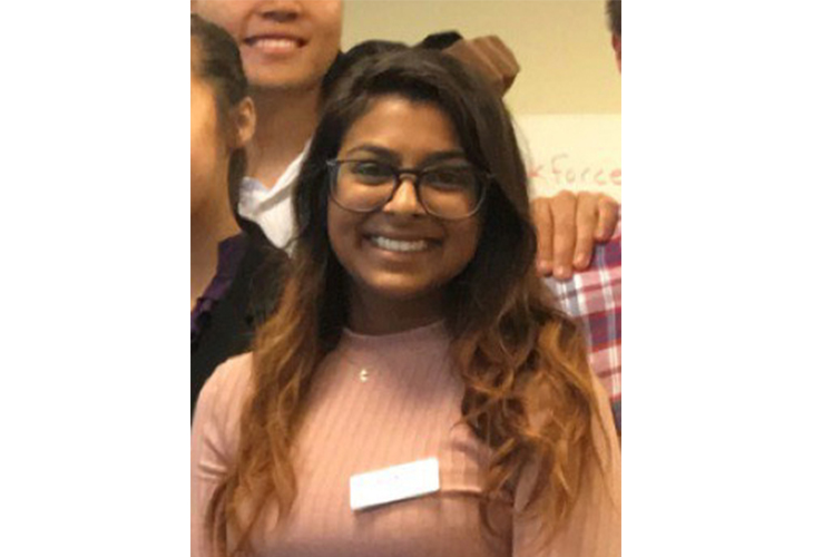 A head-and-shoulders shot of Annie standing with several other classmates