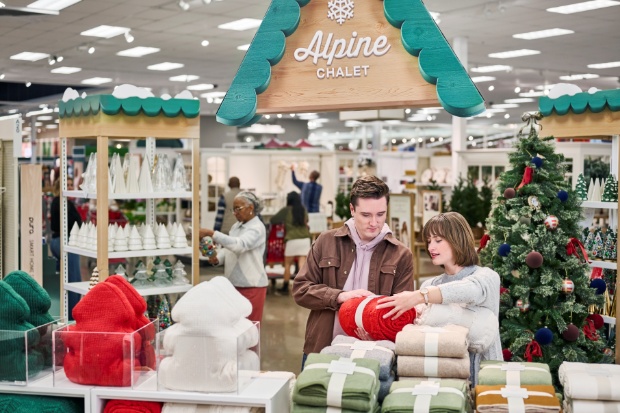 A detailed view of holiday products arranged in the Alpine Chalet display inside a Target store.