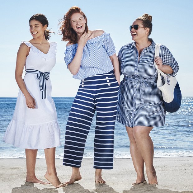 a group of women in dresses