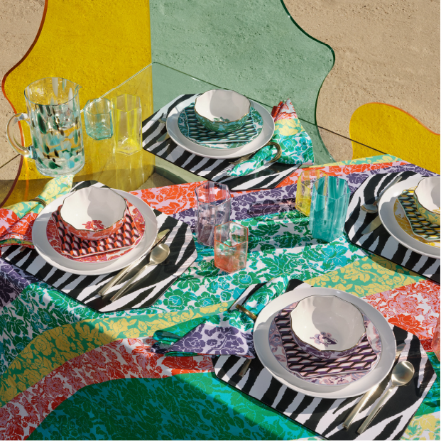 A table setting with mix and match colorful patterns.