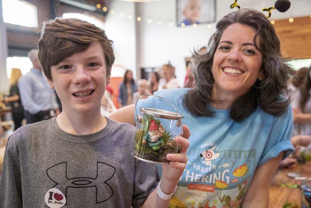 a boy and girl holding a trophy