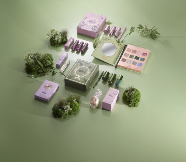 A group of pink and green makeup products from Wicked actress Ariana Grande’s beauty line R.E.M.