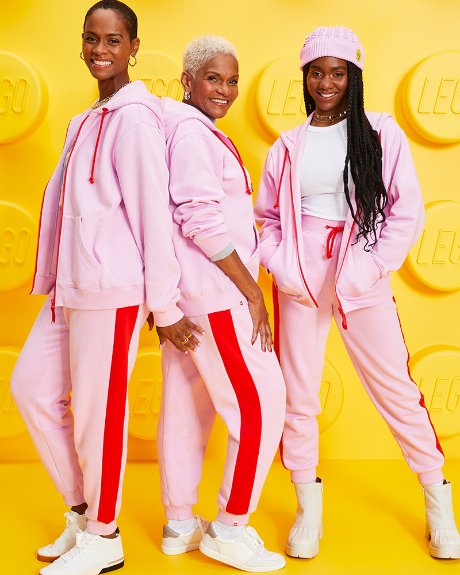 a group of people in pink suits