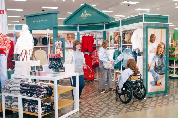 Holiday apparel section with Alpine Hotel signage.