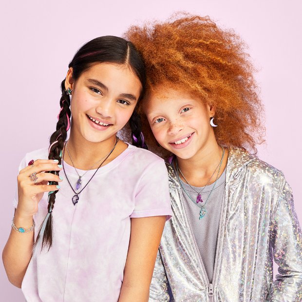 a couple of women posing for the camera