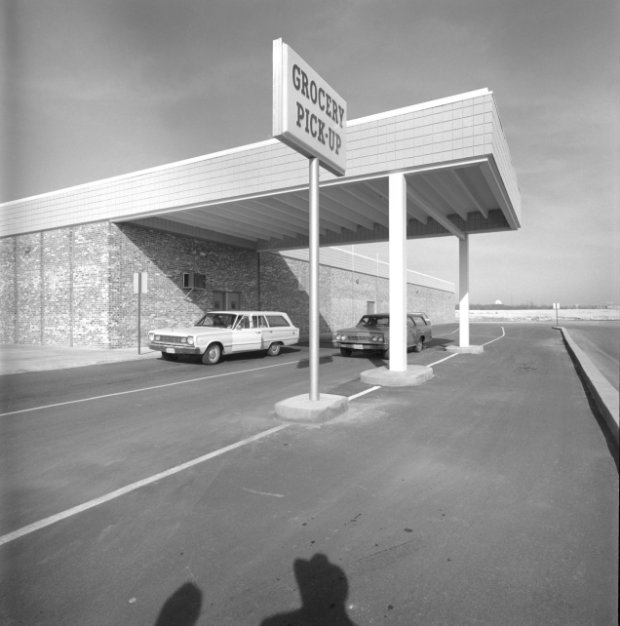 a car park with a sign