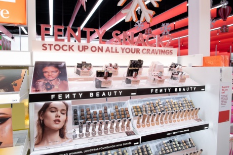 A Fenty Beauty display shows off makeup for a large range of skin tones.