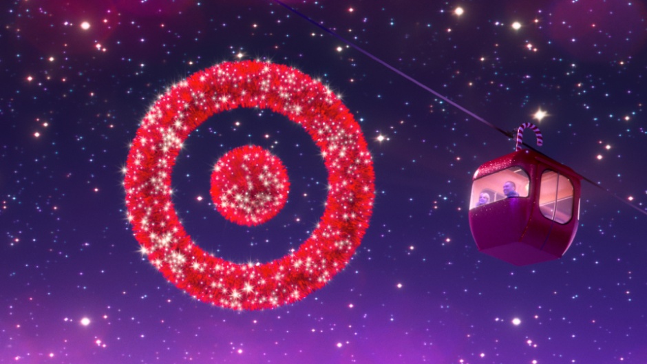 A sparkling red Target Bullseye hangs in the night sky as a red gondola goes by.