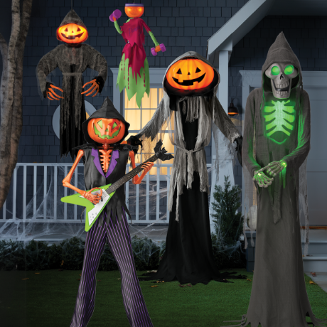 Lewis the Pumpkin Ghoul surrounded by Pumpkin Rocker Billy, Little Lewis, Pumpkin Iron Lewcy and Bruce the Skeleton Ghoul, in front of a house.