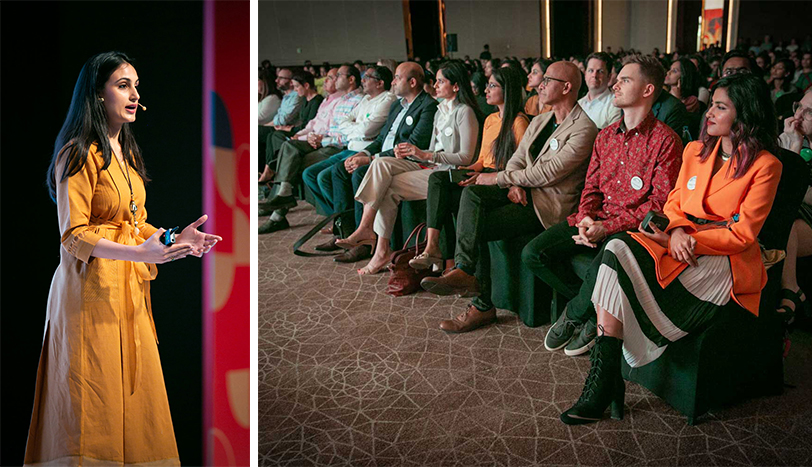 a person standing in front of a group of people sitting in chairs